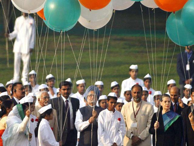 President Pratibha Patil, left, Prime Minister Manmohan Singh and Congress Party chief Sonia Gandhi, right, prepare to release balloons at the memorial of first Prime Minister Jawahar Lal Nehru, on Nehru's birth anniversary in New Delhi.