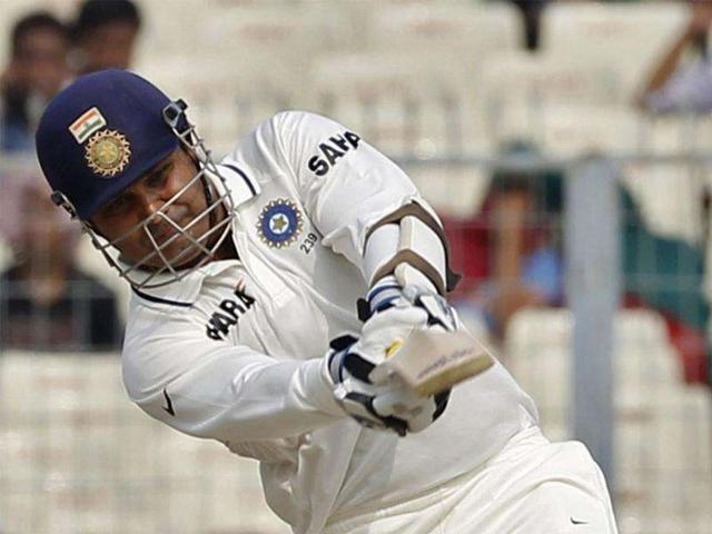 Virender Sehwag plays a shot on the first day of their second Test cricket match against West Indies in Kolkata.