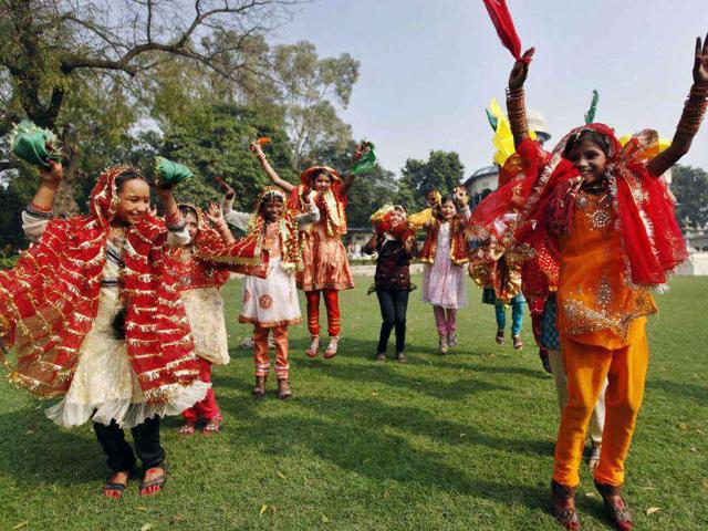 Children participate in a traditional dance to celebrate the nation's first Prime Minister Jawahar Lal Nehru's birth anniversary at his ancestral home, Anand Bhawan in Allahabad.