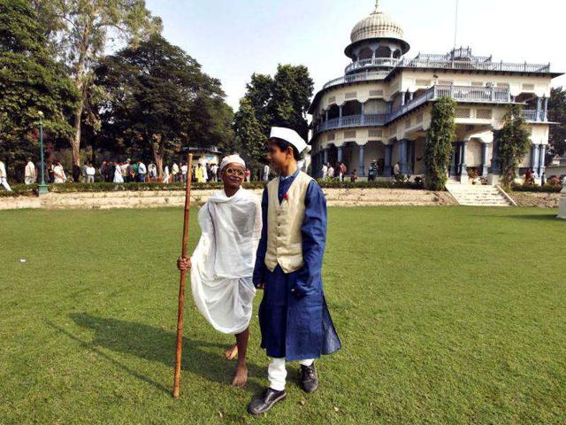 School children dressed as Mahatma Gandhi, left, and India's first Prime Minister Jawahar Lal Nehru walk during Nehru's birth anniversary at his ancestral home, Anand Bhawan in Allahabad.