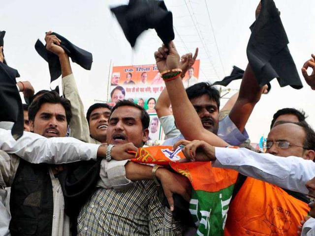 BJP activists showing black flags to AICC General Secretary Rahul Gandhi on his arrival at a rally in Phoolpur near Allahabad. UNI