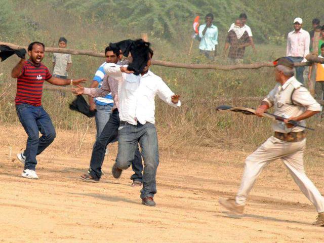 A group of student leaders showing black flags to Rahul Gandhi. HT