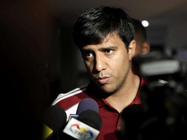Venezuela's coach Cesar Farias speaks to journalists during a press conference after a training session in San Cristobal. (AP Photo/Ariana Cubillos)