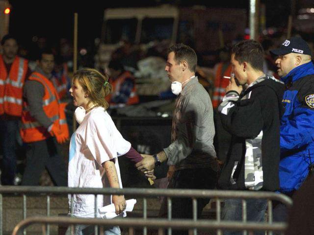 Members of the New York Police Department escort members of the Occupy Wall Street movement from Zuccotti Park in New York.