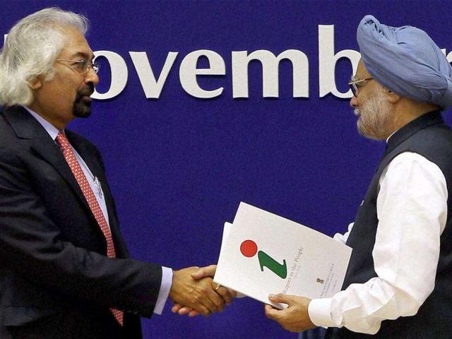 Prime Minister Manmohan Singh and his advisor on public information, infrastructure and innovations, Sam Pitroda during the release of the first report of 'National Innovation Council' at a function in Vigyan Bhawan, New Delhi.