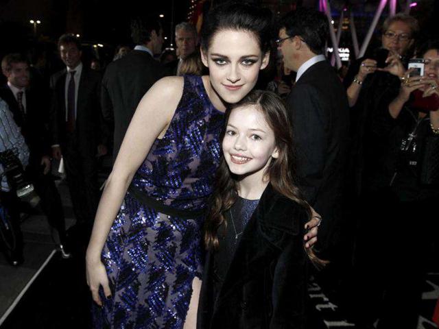 Kristen Stewart, left with her on-screen daughter Mackenzie Foy at the world premiere of The Twilight Saga: Breaking Dawn - Part 1. (AP Photo/Matt Sayles)