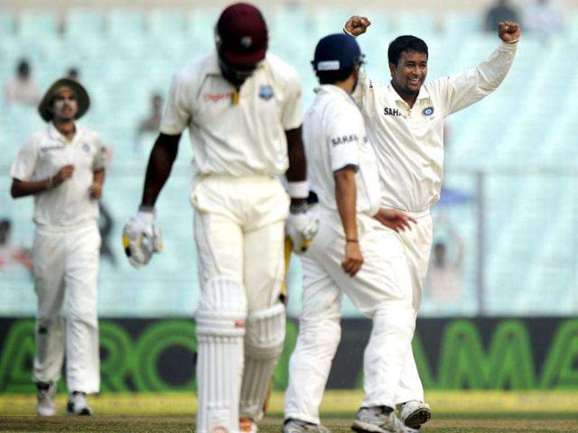 Pragyan-Ojha-celebrates-with-teammates-after-taking-the-wicket-of-West-Indies-cricketer-Kirk-Edwards-2nd-L-during-the-third-day-of-the-second-Test-match-between-Indian-and-West-Indies-at-the-Eden-Gardens-in-Kolkata-India-is-leading-the-3-match-Test-series-by-1-0-----AFP-PHOTO-Dibyangshu-Sarkar Pragyan-Ojha-celebrates-with-teammates-after-taking-the-wicket-of-West-Indies-cricketer-Kirk-Edwards-2nd-L-during-the-third-day-of-the-second-Test-match-between-Indian-and-West-Indies-at-the-Eden-Gardens-in-Kolkata-India-is-leading-the-3-match-Test-series-by-1-0-----AFP-PHOTO-Dibyangshu-Sarkar