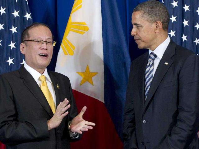 US President Barack Obama listens to Philippine President Benigno Aquino (L) during their meeting on the sidelines of the Association of Southeast Asian Nations (ASEAN) and East Asia summits in Nusa Dua in Bali.