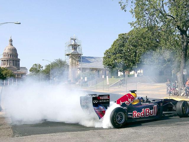 Smoke-spills-off-of-the-tires-of-the-Red-Bull-Formula-One-car-as-the-driver-David-Coulthard-does-a-series-of-doughnuts-during-the-making-of-a-promotional-video-in-Austin-Texas-File-photo Smoke-spills-off-of-the-tires-of-the-Red-Bull-Formula-One-car-as-the-driver-David-Coulthard-does-a-series-of-doughnuts-during-the-making-of-a-promotional-video-in-Austin-Texas-File-photo
