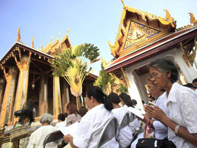 Buddhists pray for flood victims at Emerald Buddha Temple in Bangkok. Nearly a third of Thailand's 77 provinces, including Bangkok, have been hit by floods since late July.