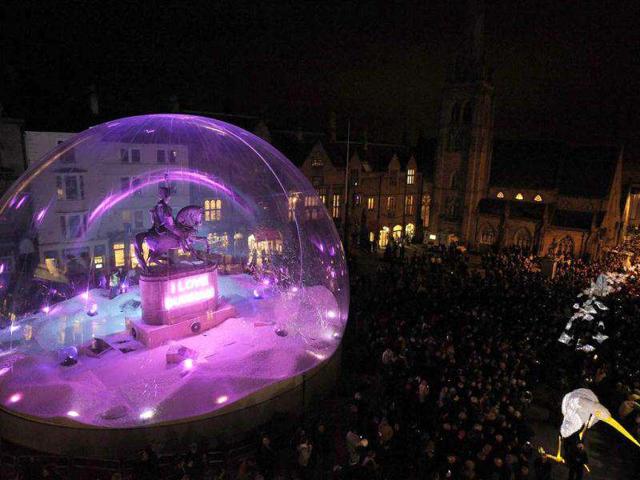 A statue of the Marquess of Londonderry is transformed by French artist Jacques Rival into 'I Love Durham' a snowdome of light encasing the statue in the Market Square in Durham, northern England. Durham Lumiere, the UK's largest light festival brings, together 35 British and international artists working with light from November 17 to 20. Reuters/Nigel Roddis