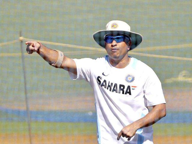 Sachin Tendulkar gestures during a training session ahead of their third Test cricket match against West Indies in Mumbai.