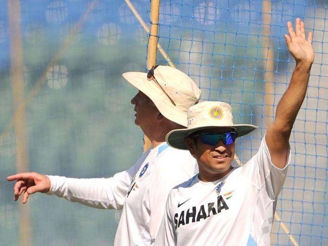 Sachin Tendukar (R) and coach Duncan Fletcher gesture during a practice session at the Wankhede stadium in Mumbai.