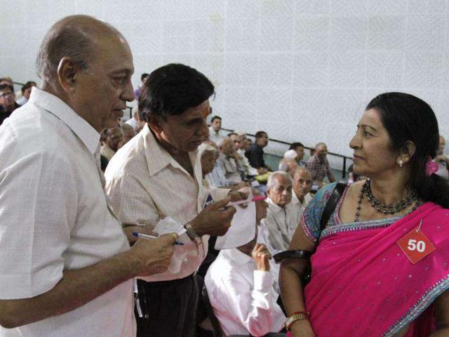 A participant gets ready before her introduction during a function held to help people aged above fifty years find live-in relationship partner in Ahmedabad. AP Photo/Ajit Solanki
