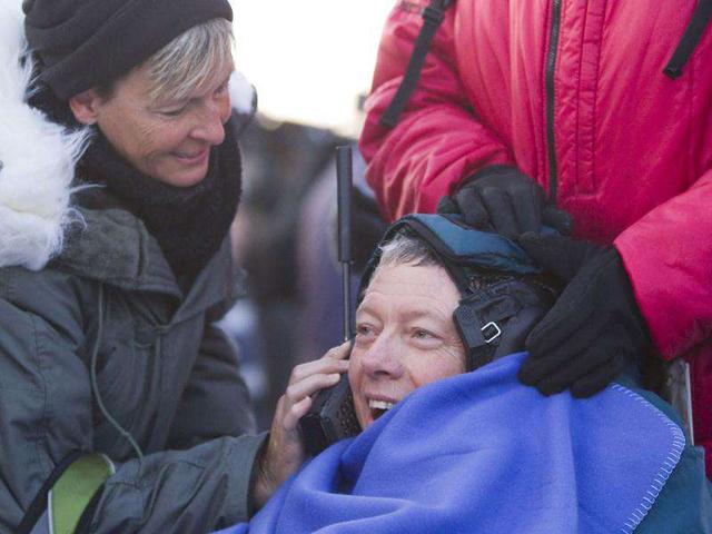 US astronaut Mike Fossum speaks on a satellite phone shortly after his landing in Soyuz TMA-02 capsule near the town of Arkalyk in northern Kazakhstan.. AFP Photo / Shamil Zhumatov