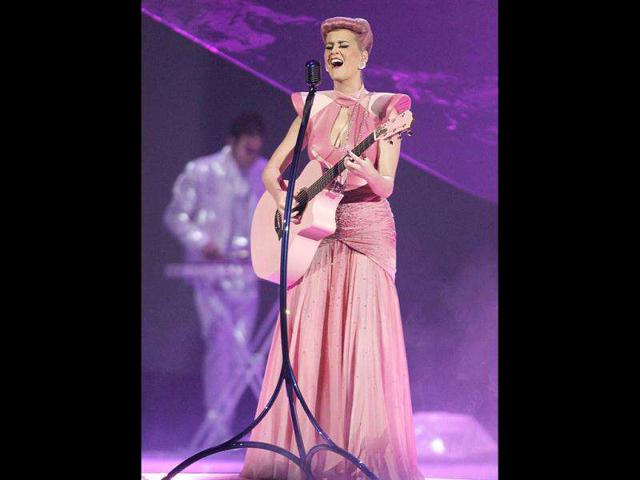 Katy Perry croons in pink yet again, this time with a pink guitar as well. Katy Perry croons in pink yet again, this time with a pink guitar as well.