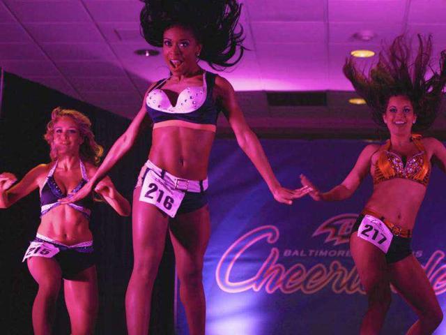 Cheerleader hopefuls perform during an event called "Making the Cut" to select the 2011 Ravens cheerleaders in Baltimore.