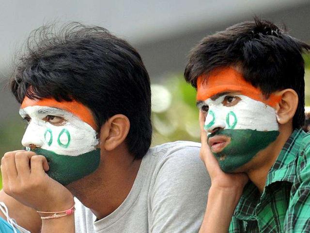 Cricket fans watch action during the fourth day's play of the third Test cricket match between India and West Indies at The Wankhede Stadium in Mumbai.