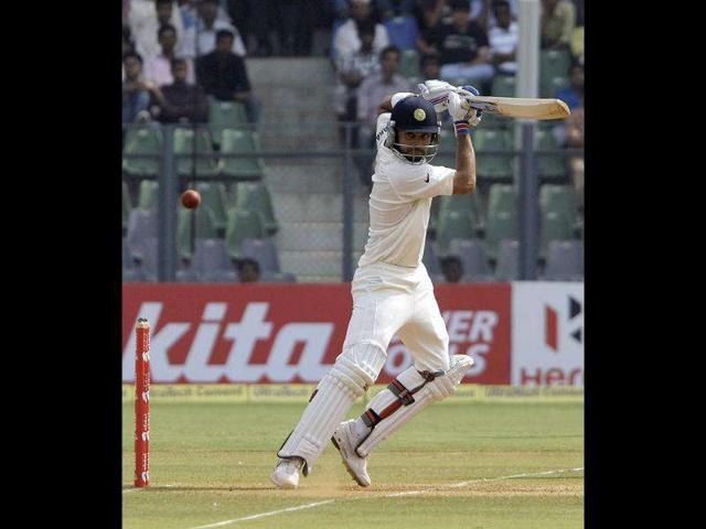 Virat Kohli plays a shot during the fourth day of their third and final Test cricket match against West Indies in Mumbai.