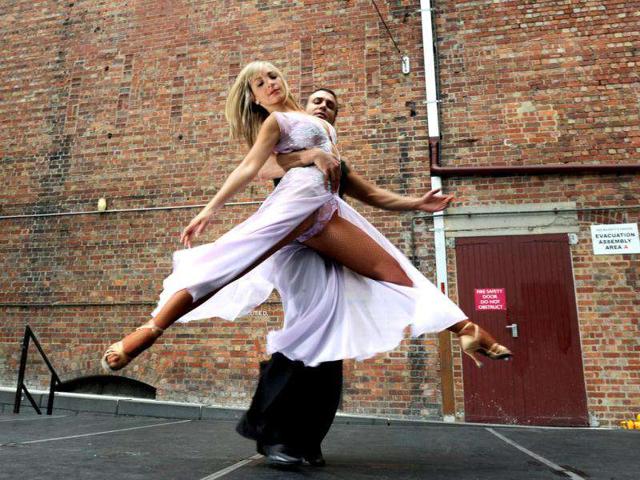 Jessica Raffa (L) and Carmelo Pizzano (R) dance in Melbourne's Chinatown in front of the lunchtime crowds, promises to be an exciting ‘Festival of Dance’.