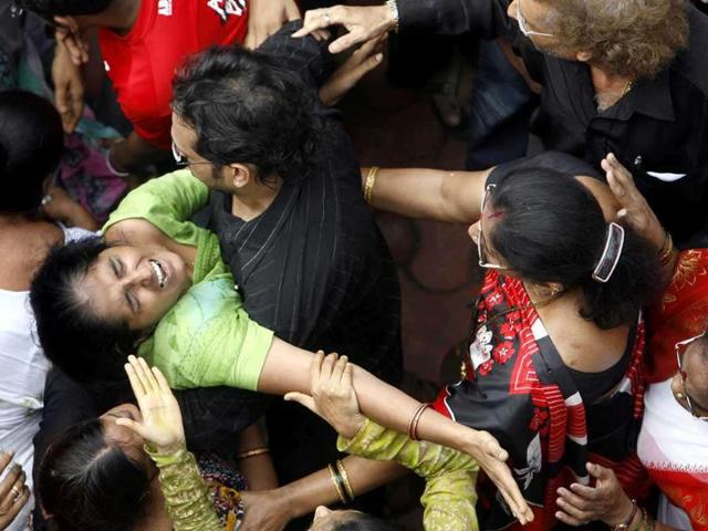 A relative mourns the death of Harish Gohil, who was killed by a gunman's bullet at Nariman House, during a funeral in Mumbai. Reuters/Punit Paranjpe