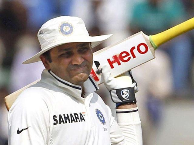 Virender Sehwag walks off the field after being dismissed by West Indies' Devendra Bishoo during the fifth day of their third and final Test cricket match in Mumbai.