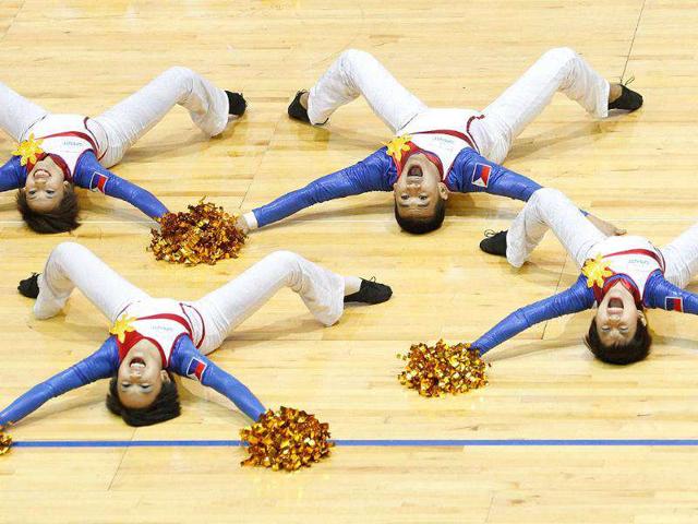 Members of the Philippines team perform during the cheer dance competition at the the Cheerleading World Championships in Hong Kong. The 6th Cheerleading World Championships is a biennial event featuring some 70 teams from over 20 countries. AFP PHOTO / Dale de la Rey
