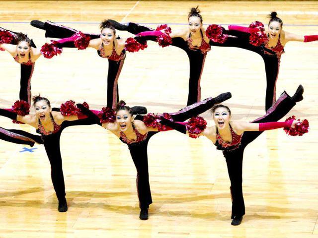 Members of the Taiwan team perform during the cheer dance competition at the the Cheerleading World Championships in Hong Kong. The 6th Cheerleading World Championships is a biennial event featuring some 70 teams from over 20 countries. AFP PHOTO / Dale de la Rey