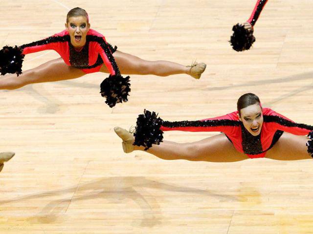 Members of the German team perform during the cheer dance competition at the the Cheerleading World Championships in Hong Kong. The 6th Cheerleading World Championships is a biennial event featuring some 70 teams from over 20 countries. AFP PHOTO / Dale de la Rey