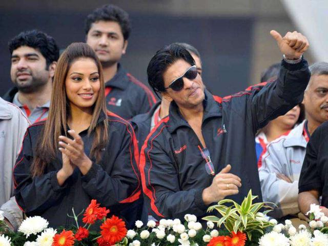 Shah Rukh Khan and Bipasha Basu at the start/finish area of the Airtel Delhi Half Marathon. (Photo: AP)