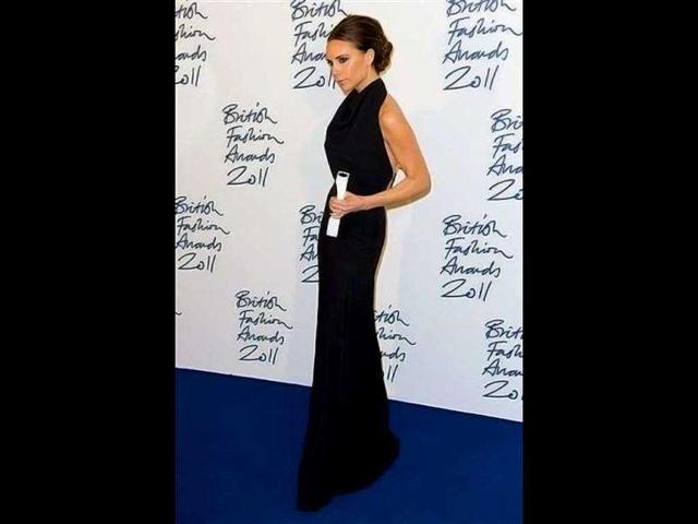 Victoria Beckham in a black backless gown definitely doesn't look like she recently gave birth. (AP)