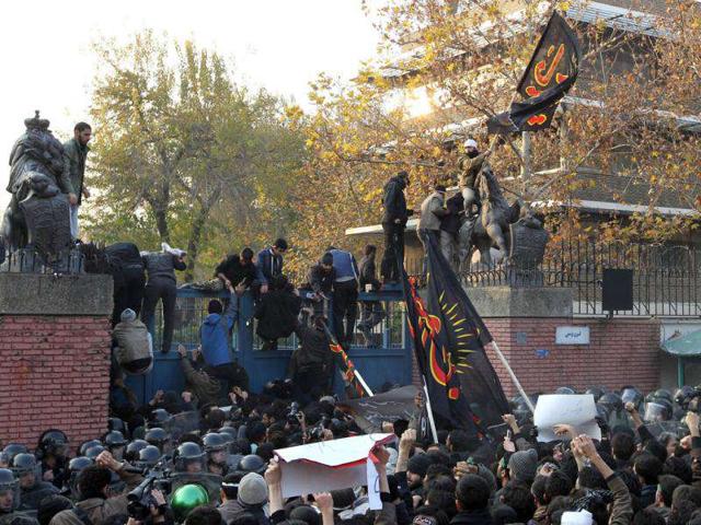 Iranian protesters break into the British embassy in Tehran. AFP Photo/Atta Kenare