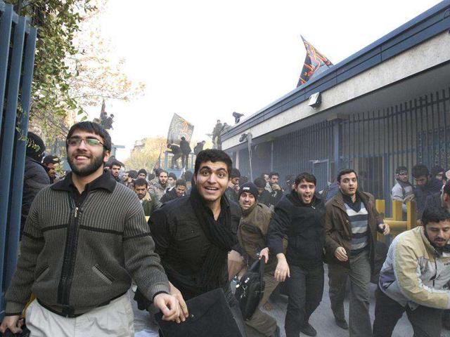 Iranian protesters enter the British Embassy in Tehran, Iran. The mob moved into the diplomatic compound two days after Iran's parliament approved a bill that reduces diplomatic relations with Britain following London's support of recently upgraded Western sanctions on Tehran over its disputed nuclear program. AP Photo/Vahid Salemi