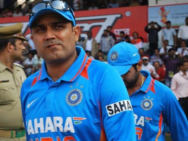 Virender Sehwag with teammates coming into the field to play their 1st ODI against West Indies at Barbati Stadium in Cuttack.