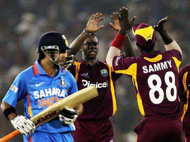 West Indies' Kemar Roach celebrates the dismissal of Gautam Gambhir during the first ODI cricket match in Cuttack. PTI