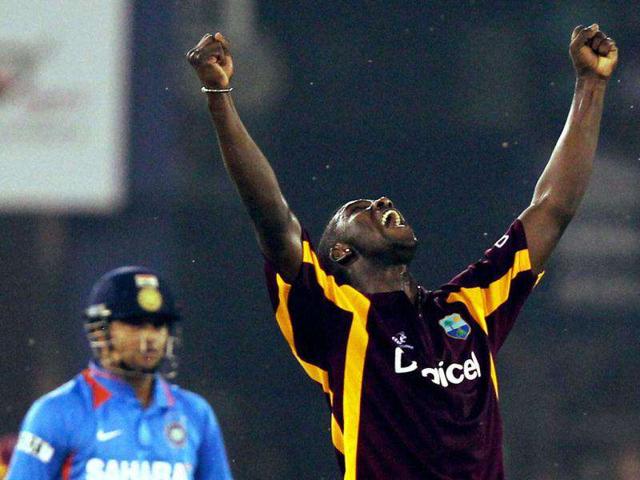 West Indies bowler Andre Russell reacts after pickup Indian batsman Suresh Raina in Cuttack. PTI
