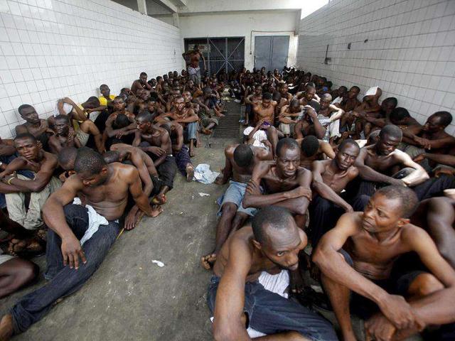 Prisoners held by forces loyal to Ivory Coast presidential claimant Alassane Ouattara are seen in Abidjan in this file photo. The International Criminal Court confirmed former Ivory Coast President Laurent Gbagbo had been detained in The Hague on November 30, 2011, following his arrest on charges of crimes against humanity and transfer from Ivory Coast overnight. (Reuters)