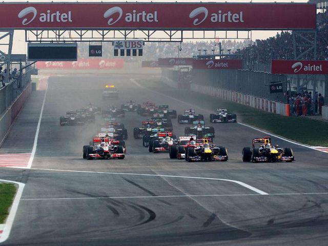 Sebastian-Vettel-R-of-Germany-and-Red-Bull-Racing-leads-at-the-start-of-the-Indian-Formula-One-Grand-Prix-at-the-Buddh-International-Circuit-in-Noida Sebastian-Vettel-R-of-Germany-and-Red-Bull-Racing-leads-at-the-start-of-the-Indian-Formula-One-Grand-Prix-at-the-Buddh-International-Circuit-in-Noida