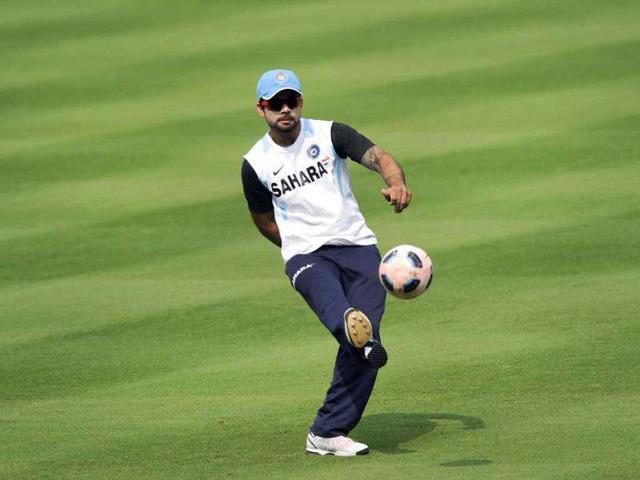 Virat Kohli plays a game of football during a training session at the Dr YS Rajasekhara Reddy Cricket Stadium in Visakhapatnam.