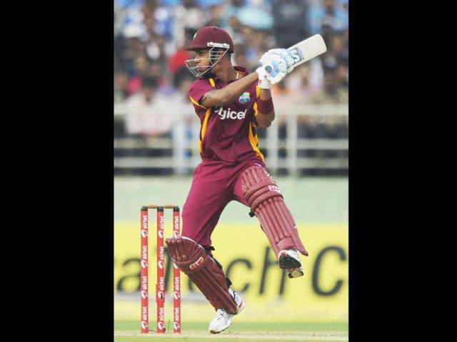 West Indies cricketer Lendl Simmons plays a shot during their second One Day International (ODI) match against India at The YS Rajasekhara Reddy Cricket Stadium in Visakhapatnam.