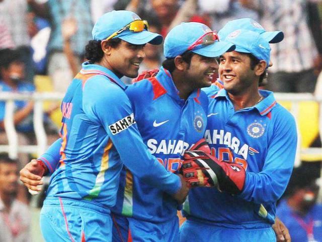 Suresh Raina (C) and others celebrate after he took the catch of Marlon Samuels in the 2nd ODI against West Indies at Dr YS Rajasekhara Reddy Cricket Stadium.