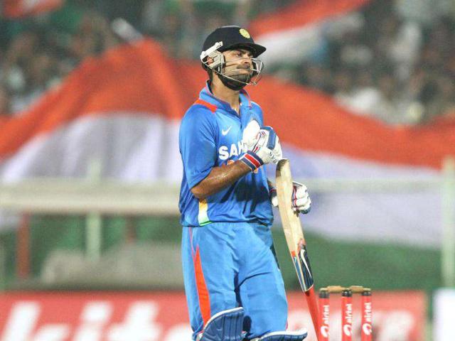 Virat Kholi celebrates after scoring a half century in the 2nd ODI against West Indies, at the Dr YS Rajasekhara Reddy cricket stadium. (HT Photo/Ashok Nath Dey)