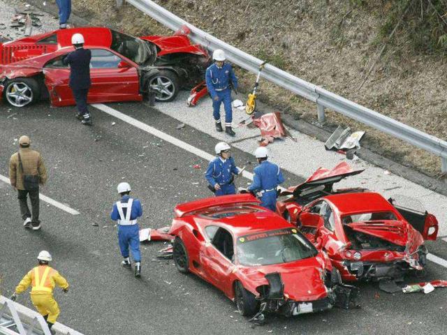 Police-officers-investigate-wrecked-luxury-cars-on-the-Chugoku-Expressway-in-southwestern-Japan-Ten-people-were-slightly-injured-in-the-pile-up-involving-eight-Ferraris-a-Lamborghini-two-Mercedes-Benz-and-two-Japanese-cars Police-officers-investigate-wrecked-luxury-cars-on-the-Chugoku-Expressway-in-southwestern-Japan-Ten-people-were-slightly-injured-in-the-pile-up-involving-eight-Ferraris-a-Lamborghini-two-Mercedes-Benz-and-two-Japanese-cars