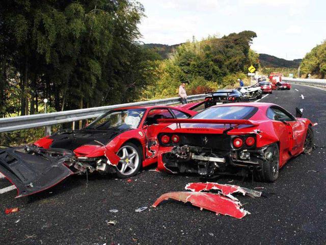 A damaged Ferrari sports car lies along a stretch of the Chugoku highway in Shimonoseki, western Japan following a 14-vehicle pile up. 8 Ferraris, 3 Mercedes-Benzes and a Lamborghini were involved in the accident on the highway in western Japan in May 2011, with 10 people taken to hospital but none seriously injured. AFP/Yomiuri Shimbun