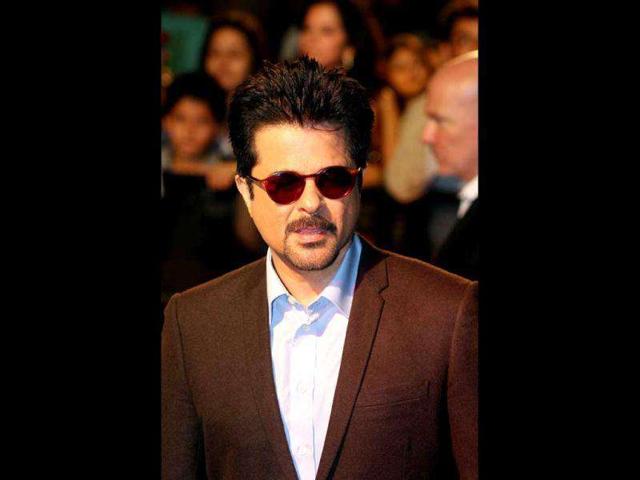 Anil Kapoor, in a black suit, looks half his age. AFP photo