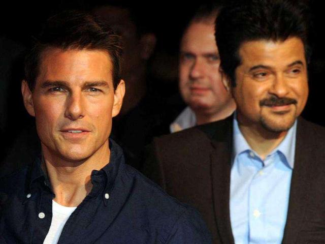 Tom Cruise along with Anil Kapoor at the red carpet. AFP PHOTO/Indranil Mukherjee