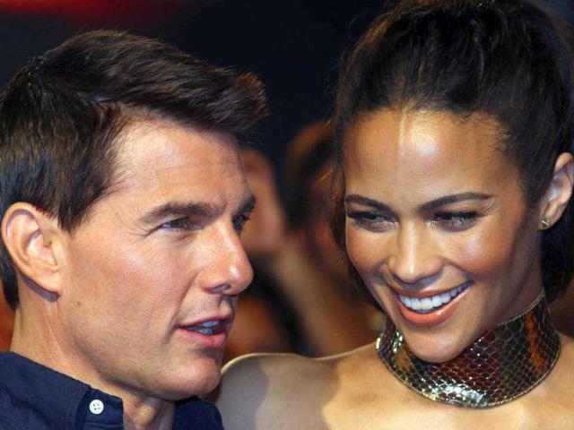 Tom Cruise and Paula Patton pose at the event. AP Photo/Rajanish Kakade