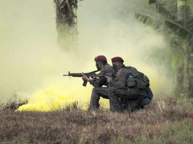 Kaibiles, members of Guatemala's special forces, participate in an exhibition to commemorate a graduation ceremony in Poptum, Peten, 400 km (248 miles) away from Guatemala City. Reuters/Jorge Dan Lopez