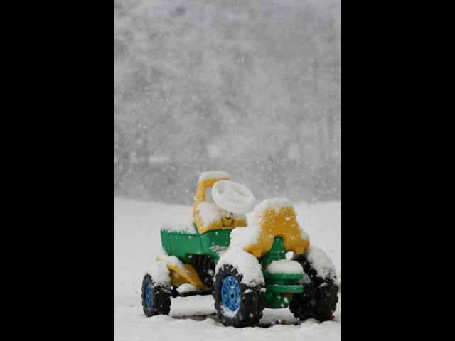 A tractor stands in blowing snow near Maierhoefen, southern Germany. AFP photo