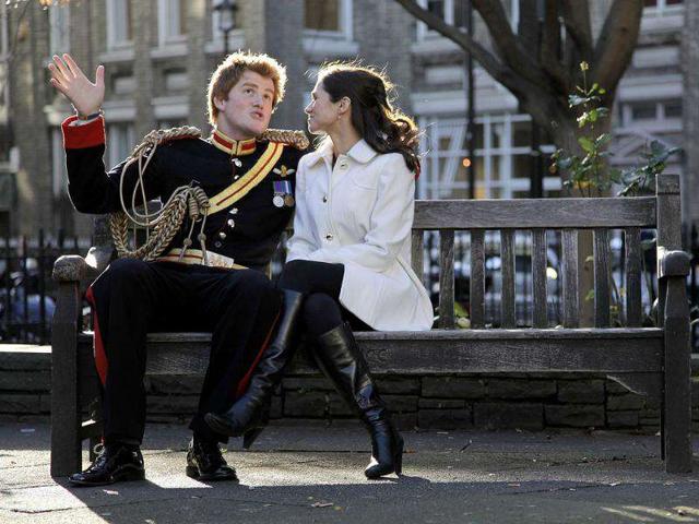 Lookalikes of Britain's Prince Harry and Pippa Middleton pose on a park bench during a media event to promote a new book by photographer Alison Jackson, in London. Reuters Photo